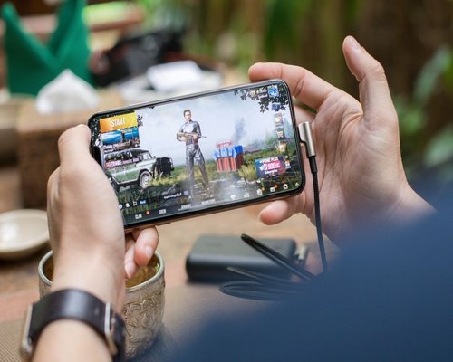 Mobile gaming demonstration shown on a smartphone screen during a technology showcase