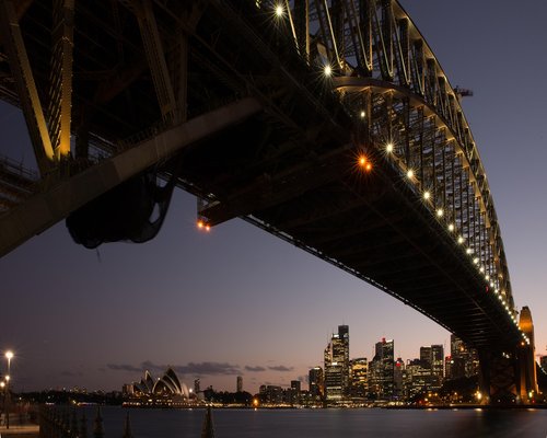 Sydney Harbour view featuring the Opera House and city energy